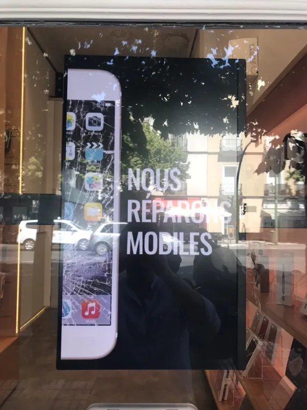 Digital signage in storefront — mobile repair